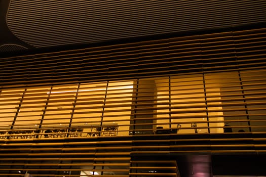 Loft bar style in night time. Lighting and wooden decor restaurant. Low angle, bottom view