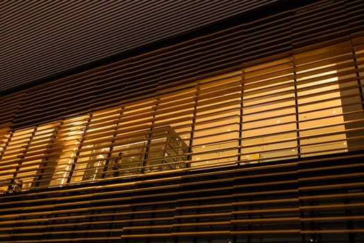 Loft bar style in night time. Lighting and wooden decor restaurant. Low angle, bottom view