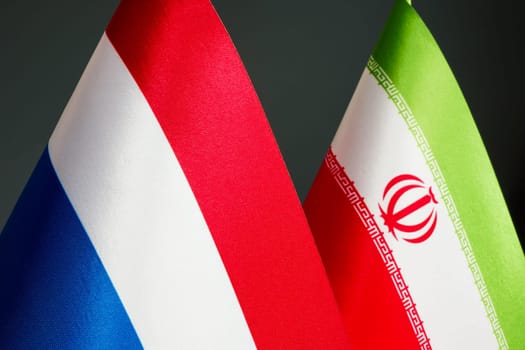 Close up of the flags of the Netherlands and Iran.