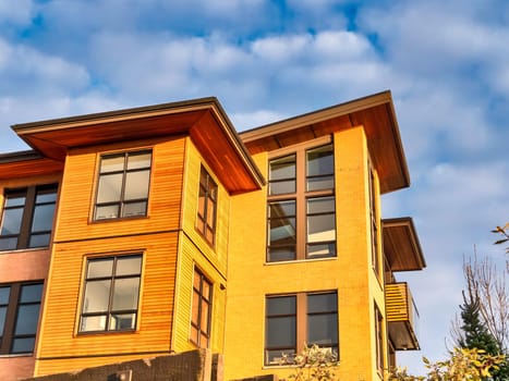 Top of residential building in Queensborough community in golden sunset light