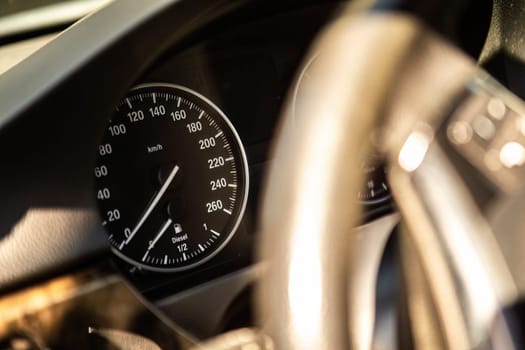 A close up of a speedometer inside a car, showing the speed dial reaching high numbers as the vehicle accelerates.