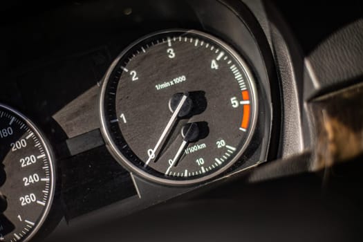 A close-up view of a speedometer on a car, capturing the dynamic movement of the needle as it responds to the vehicles speed on the road.
