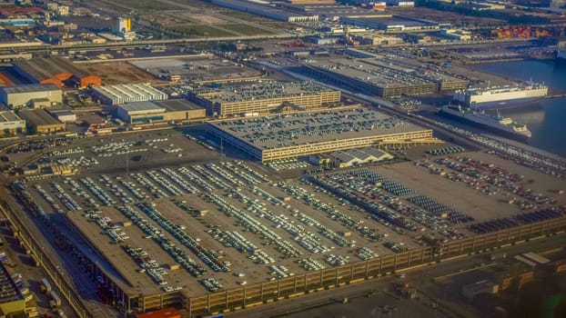 view of the parking lot from the height of the plane, a lot of cars in the parking lot