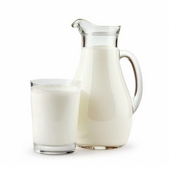 High-quality image of fresh milk in clear glass and jug isolated on white background, perfect for dairy industry and nutrition concepts.