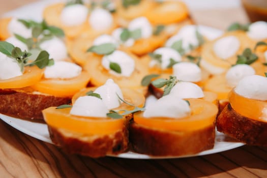 Bruschetta with tomatoes and cheese. Italian dish, cooking at a culinary master class. Cooking at home, home food, home chef.