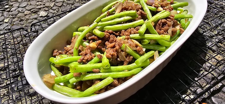 String green bean or french beans with minced beef stir fry or sauteed called Tumis buncis daging sapi cincang in Indonesia, selective focus