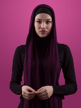 Modern Muslim woman wearing stylish hijab casual wear isolated on pink background. Diverse people model hijab fashion concept. High quality photo