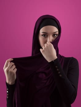 Modern Muslim woman wearing stylish hijab casual wear isolated on pink background. Diverse people model hijab fashion concept. High quality photo