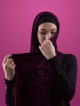 Modern Muslim woman wearing stylish hijab casual wear isolated on pink background. Diverse people model hijab fashion concept. High quality photo