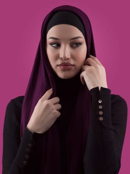 Modern Muslim woman wearing stylish hijab casual wear isolated on pink background. Diverse people model hijab fashion concept. High quality photo