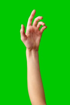 A human hand stretches upward into the air against a solid green background. The fingers are outstretched and reaching as if trying to grasp something above. The hand is the focal point, contrasting against the vibrant green backdrop.