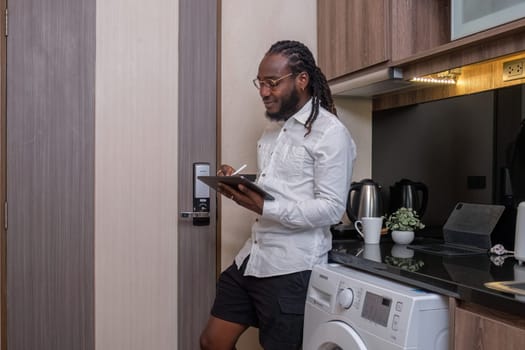 Young African American businessman dressed casually Work from your laptop while you're on vacation by working from home..