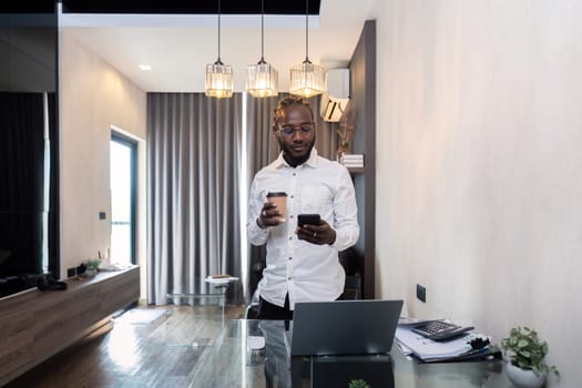 African American young man browsing internet on smartphone at home, African American young man read news check texting or message.