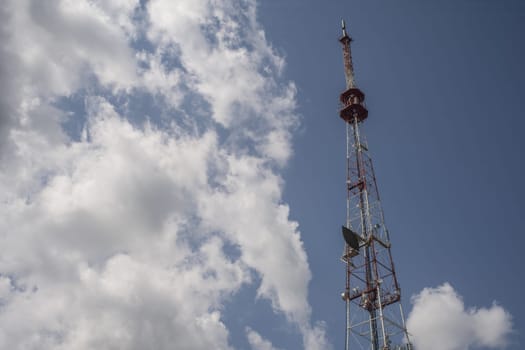 Telecommunication towers include of radio microwave and television antenna system with cloud blue sky .