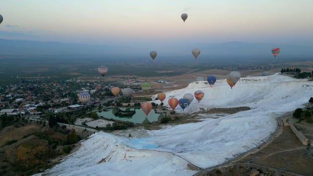 Pamukkale,Denizli,Turkey - October 15, 2023, hot air balloons flying over Pamukkale. High quality 4k footage