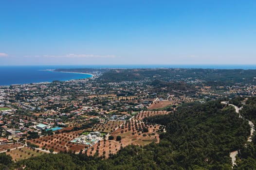 Beautiful panoramic view of the Aegean sea with the village and the blue sky from the Filerimos mountain in Greece on the island of Rhodes, close-up side view.
