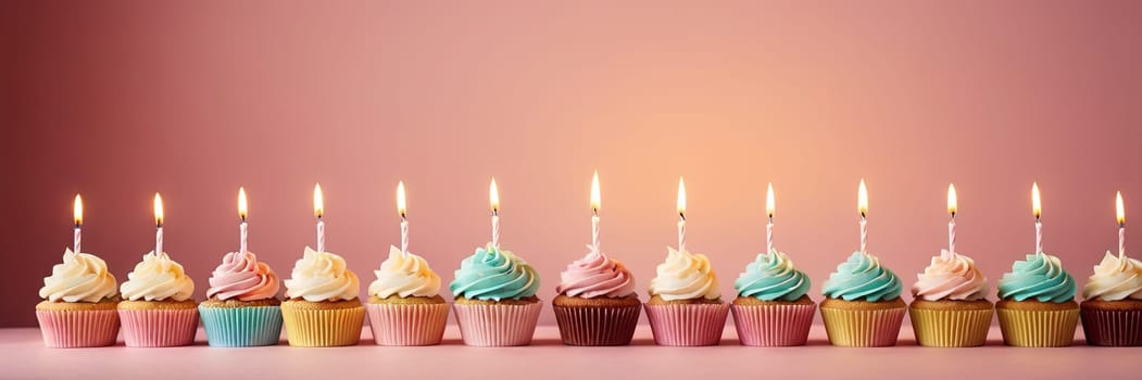 Colorful cupcakes with lit candles are displayed against a pink background, indicating an indoor celebration event marking of joy and celebrating. with free space.