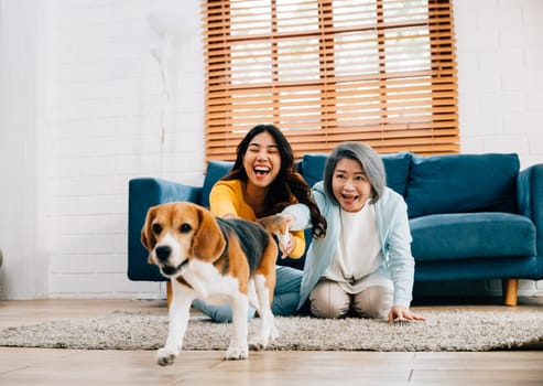 Weekend playtime, A cheerful woman and her mother run alongside their Beagle dog in the living room, highlighting their friendly bond and love for an active lifestyle. pet love