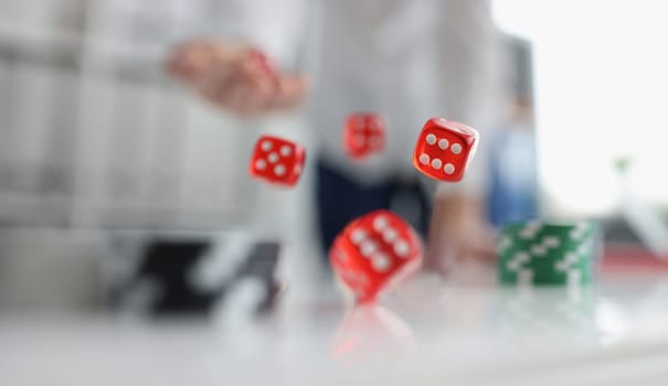 Closeup of man throwing dice. Gambling concept