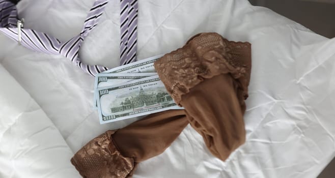 Women stockings men tie and cash dollar bills. Intimate services and sex for money concept