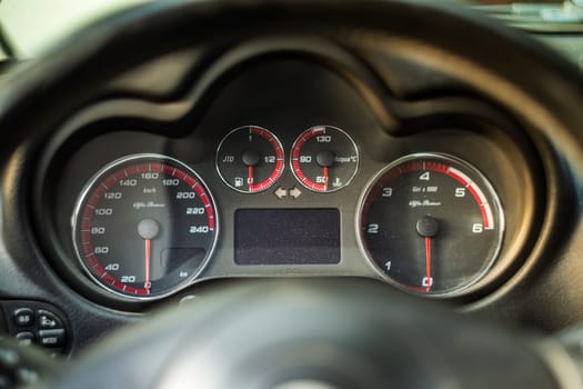 Milan, Italy 9 April 2024: Close-up photo of the instrument cluster on the dashboard of an Alfa Romeo GT.
