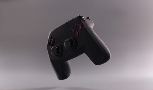 Black plastic wireless gamepad on gray background. Game joystick concept