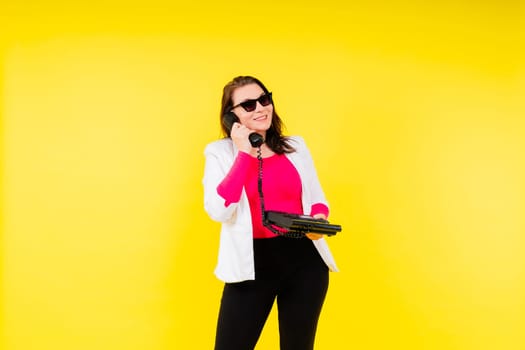 Photo of a plump lady talking retro phone empty space isolated yellow color background