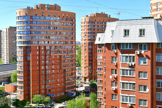 Khimki, Russia - May 10. 2018. Cityscape with the residential buildings, cars and road