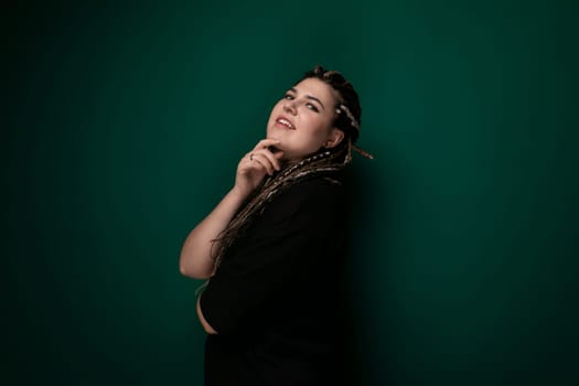 A woman leaning against a bright green wall with her hand resting on her chin, deep in thought. Her casual posture conveys a sense of contemplation, with her gaze directed ahead.