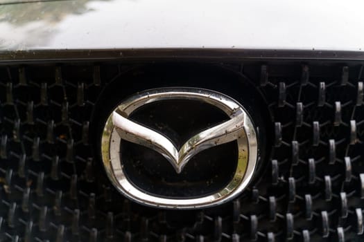 Bobruisk, Belarus - September 24, 2023: Automobile company logo - Mazda on a car.