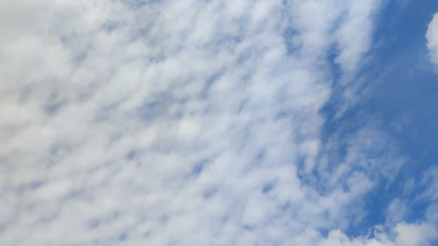 Blue gray light sky nature white clouds whether background, sun face . High quality photo