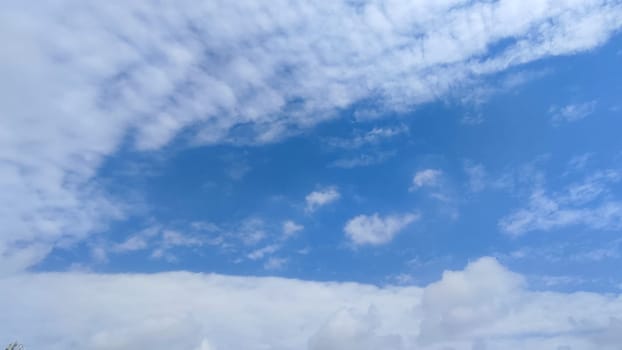 Blue gray light sky nature white clouds whether background, sun face . High quality photo