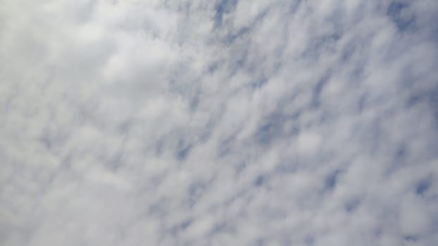 Blue gray light sky nature white clouds whether background, sun face . High quality photo