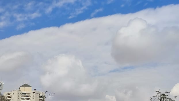 Blue gray light sky nature white clouds whether background, sun face . High quality photo