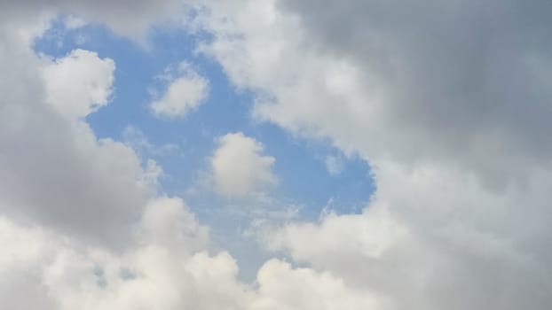 Blue gray light sky nature white clouds whether background, sun face . High quality photo