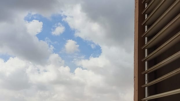 Blue gray light sky nature white clouds whether background, sun face . High quality photo