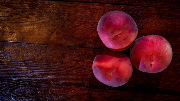 Fresh juicy peaches on rustic wooden table