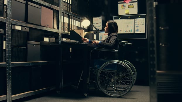 Wheelchair user conducting private investigation in disability friendly incident room, examining old cases to find connections. Detectives gathering legal information for identification. Camera B.