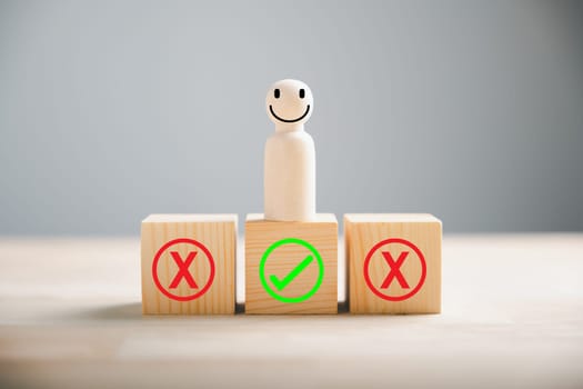 Wooden cube block displays people examining right and wrong considering yes or no. True or false symbols represent business options. Decision-making concept on wood. Think With Yes Or No Choice.