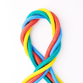 Colorful, ropes and tied for together in studio to represent unity, connect and trust. Secure, string and reef knotted for security to stop movement of objects safety on isolated white background.