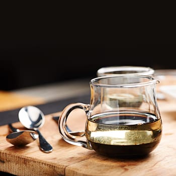 Balsamic, vinegar and olive oil in pitcher on table for marinade as liquid dressing in glass for taste on countertop. Natural, nutrition and health for antioxidants, inflammatory and help blood flow.