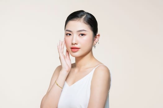 Skin care.Woman with beauty face touching healthy facial skin portrait.Asian woman.
