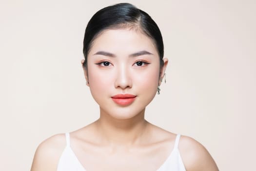 Beauty woman healthy clean skin beautiful female young model isolated on beige