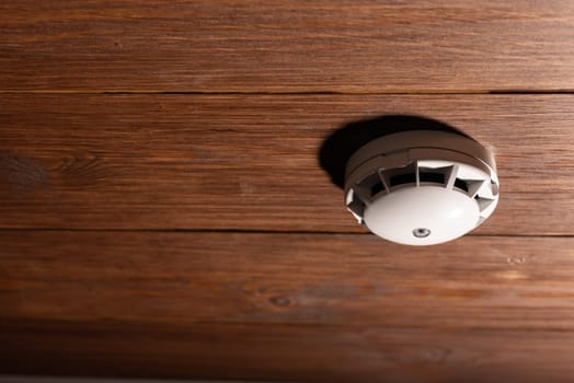 Alarm fire detected Smoke detector on wooden ceiling
