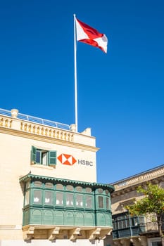 Valletta, Malta, April 03, 2024 The HSBC bank sign and flag in the city center