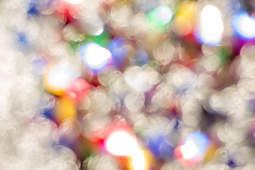 Abstract glitter color lights chrismas background. de-focused - image