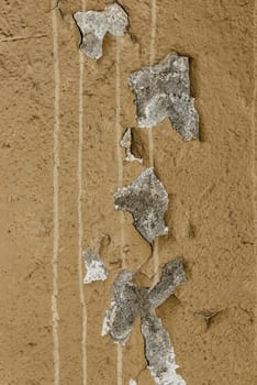 Close-up detail of cracked paint on rusty metal wall. - image