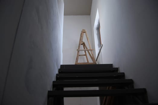 Construction work in a private house. Natural lighting of a flight of stairs.