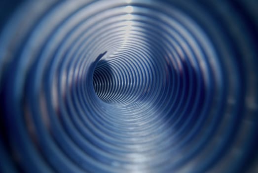 Blue, corrugated pipe. Photo from the inside.