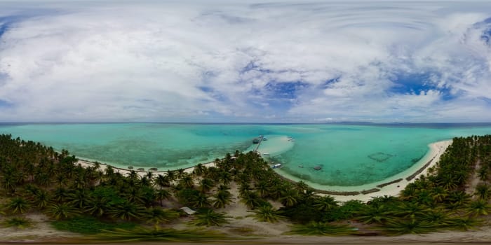 Tropical island in the blue sea with a coral reef and the beach. Onok Island, Palawan, Philippines. 360VR.